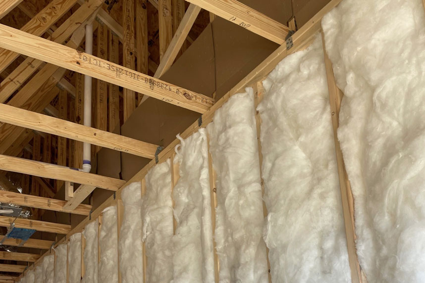 Ceiling and framing with insulation tucked between joists